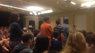 Students line up to ask the faculty panel questions at the "Lessons Within Ferguson, MO" session.