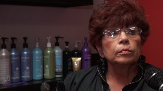 Delores Foster expresses her frustration about the new downtown proposal in her hair salon, Coming Attractions.