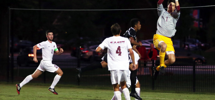 Elon Keeper Matthew Jegier makes a save in a game against Davidson. (Andrew Feather/ELN)